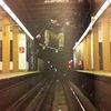 Watch A Skateboarder Jumping Over The Subway Tracks